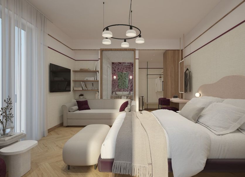 Hotel Taormina in Bardolino guest room with bed, sofa, TV, balcony doors and lake view