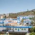 Belvedere Village in Agia Pelagia with blue-and-white hillside buildings and sea views