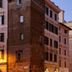 Suite Art Navona in Rome, street view of historic buildings at dusk with glowing lampposts