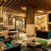 The Westin New York at Times Square lobby lounge with fireplace, seating, and modern wood ceiling in New York