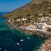 Hotel L'ariana Isole Eolie - Una Esperienze in Leni with seaside cliffside views and boats in clear water