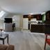Skaket Beach Motel in Orleans attic-style suite with kitchen, TV, dining area and seating