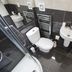 The Frocester, Stroud: compact bathroom with shower, toilet, sink and heated towel rail