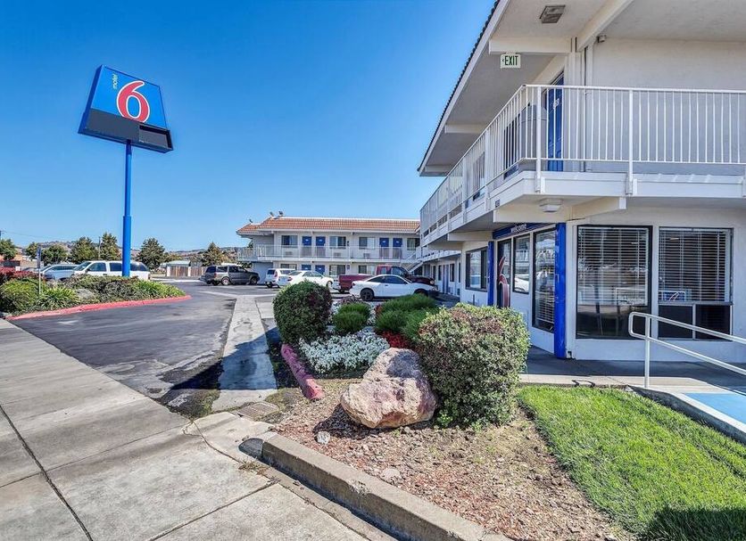 Motel 6-Vallejo, CA - Six Flags West exterior with parking lot, walkway and balcony in Vallejo