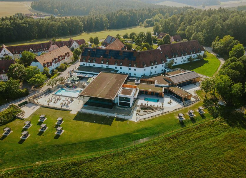 Hotel Gut Matheshof, BW Signature Collection in Ensdorf, Bavaria, with outdoor pool and lawn chairs