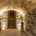 Hotel Ex-Hacienda San Xavier in Guanajuato: stone archway leading to illuminated staircase and potted plants