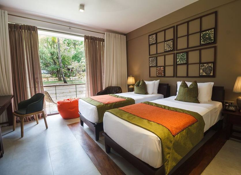Sigiriana Resort by Thilanka in Dambulla guest room with twin beds and garden view