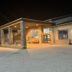 Days Inn by Wyndham Boonville entrance at night with covered drop-off and stone columns