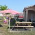La Garona in Saint-Nicolas-de-la-Grave with picnic table, pink umbrellas, and a small patio
