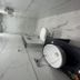 Ritumbhara Resorts Alwar bathroom with white marble tiles, large shower, and vessel sink