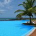 Pestana São Tomé infinity pool overlooking the ocean with palm trees in São Tomé