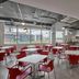City Express Junior by Marriott Guadalajara Periférico Sur breakfast room with red chairs in Tlaquepaque