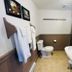Bailey House in Annapolis Royal bathroom with toilet, sink, towels, and wall mirror