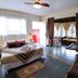 Aardvark Inn Pousada in Gramado guest room with bed, tiled floor, sitting area and balcony doors