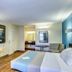 Motel 6 Dickson, TN room with queen bed, desk, chair, and wall-mounted TV