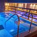 Ilsington Country House Hotel & Spa in Newton Abbot indoor spa pool with blue lighting and steps