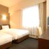 AB Hotel Toyota Motomachi twin room with two beds and window light in Toyota