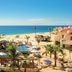 Solmar Resort in Cabo San Lucas with oceanfront pool, beach, and palm-lined resort grounds