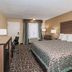 Days Inn by Wyndham Goodlettsville/Nashville guest room with king bed, desk and window seating