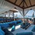 Liberty Fabay in Fethiye: beachfront cabana with blue seating, curtains, and sea views