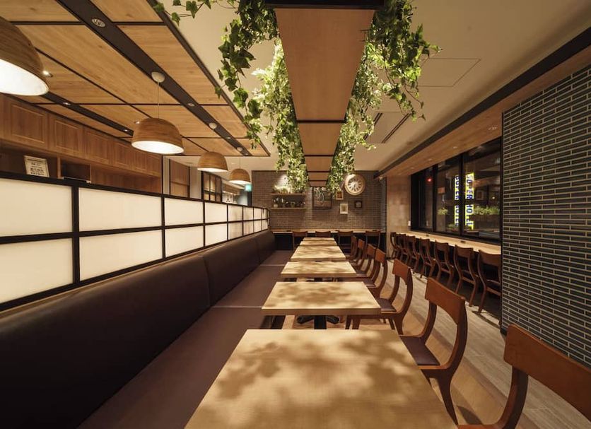 Super Hotel Hida Takayama dining area with long communal tables and warm wood lighting in Takayama