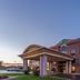 Holiday Inn Express & Suites Bowling Green By IHG exterior with covered entrance at sunset
