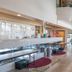 Glendale Hotel lobby with front desk, seating area, and chandelier lighting in Glendale