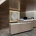 Fairfield by Marriott Inn & Suites Hailey Sun Valley lobby front desk with wood slat ceiling and wall art