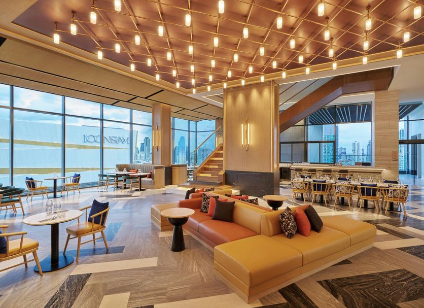 Hilton Garden Inn Bangkok Riverside lounge with river views and modern seating in Bangkok