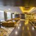 Hotel Centre Point in Nagpur lobby with seating areas, warm lighting, and polished wood flooring