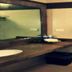 Hotel Graham Villahermosa bathroom with vanity sink, mirror, and toilet