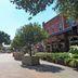 Baymont by Wyndham Savannah/Garden City in Savannah, tree-lined outdoor shopping street with planters