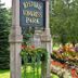 Saratoga Farmstead B&B near Congress Park in Saratoga Springs with landscaped flower beds and trees