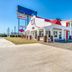 OYO Hotel Waco University Area/ I-35 in Waco, exterior of a two-story motel with arched walkways