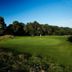 The Lodge At Meyrick Park in Bournemouth overlooking a golf course with trees under a clear blue sky