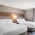 Candlewood Suites Cape Girardeau guest room with two queen beds and window view