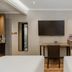 Home Inn Plus Shanghai Huaihai Road Sinan Road room with desk, TV, wardrobe and two beds