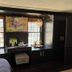 The Connecticut River Valley Inn in Glastonbury guest room with built-in window seat and colorful wall art