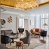 Rosewood Vienna in Vienna lounge with crystal chandelier, seating area, and large windows