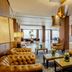 Buenos Aires Ezeiza Airport Marriott lobby with tufted sofas, lounge chairs and pendant lights in Buenos Aires