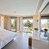Samira Exclusive Hotel & Apartments in Kalkan bedroom with balcony doors and sea views