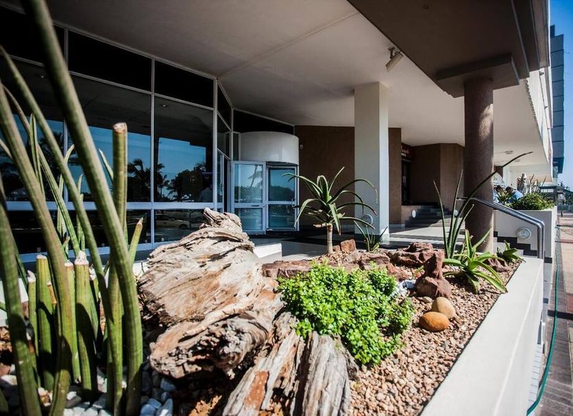 Garden Court South Beach in Durban with landscaped planter bed and hotel entrance walkway
