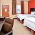La Bonita Inn & Suites - McCamey room with two beds, desk, TV and window view