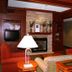 Hampton Inn South Haven lobby with fireplace, red chairs, and table lamps