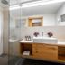 First Mountain Montafon in Gaschurn bathroom with walk-in shower and wood vanity