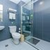 Hi Inn Shanghai Hongqiao Railway Station bathroom with shower, sink, toilet and blue tiled walls