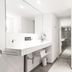 1st Floor Köln 2 bathroom with vanity, large mirror and walk-in shower in Cologne