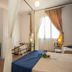Hotel Noto Marina Vista Mare in Noto room with desk, beds and sheer curtains