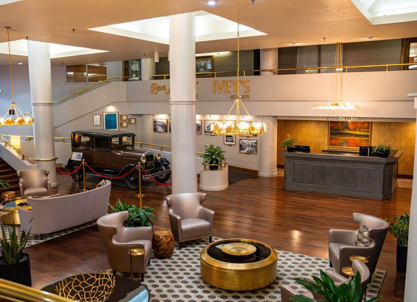 Haywood Park Hotel, an Ascend Collection Hotel in Asheville lobby with seating and vintage car display