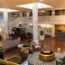 Haywood Park Hotel, an Ascend Collection Hotel in Asheville lobby with seating and vintage car display